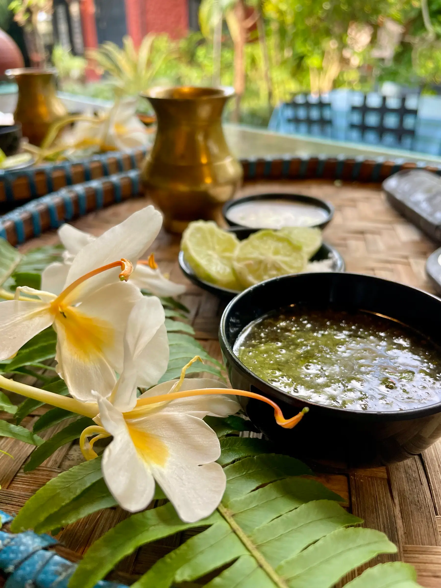 Fresh lime, flowers and a natural herbal scrub prepared in the garden