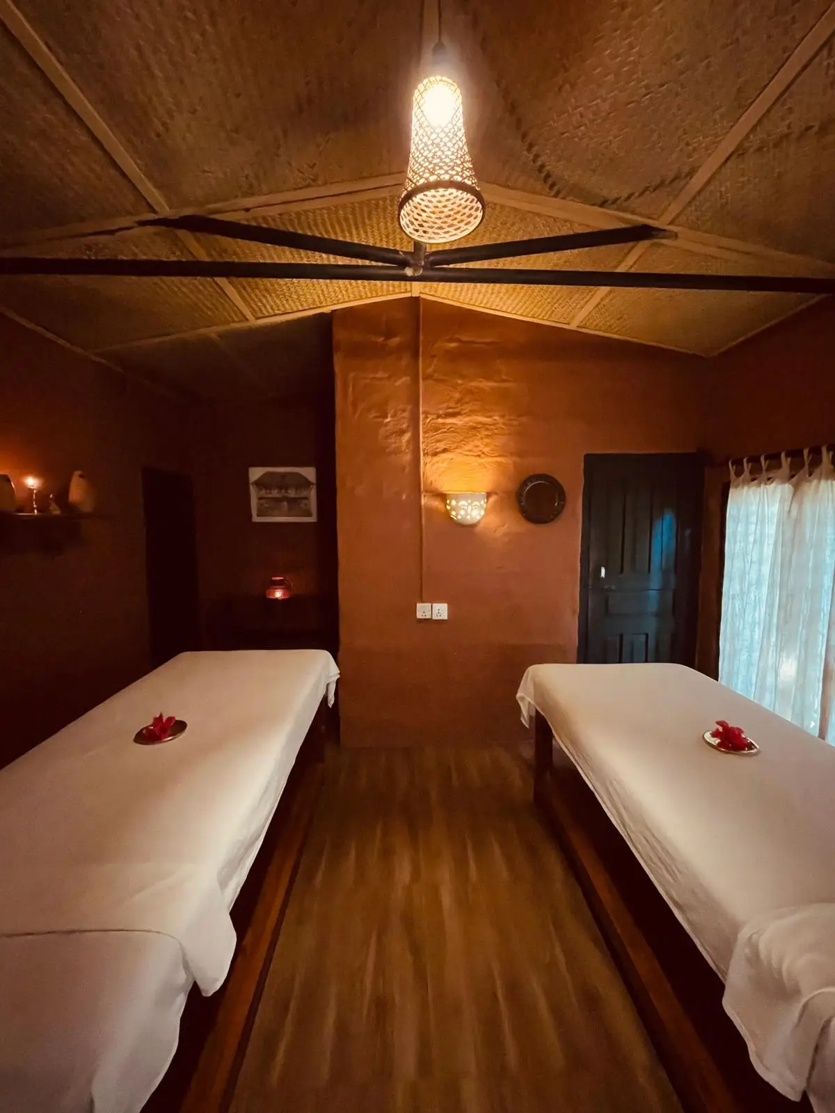 Couples treatment suite beneath a woven bamboo ceiling