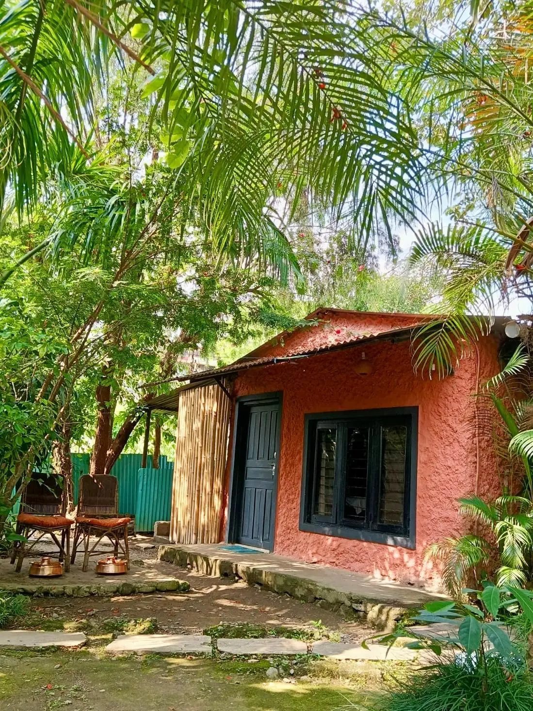 Terracotta treatment cottage in the tropical garden at Jiva Spa