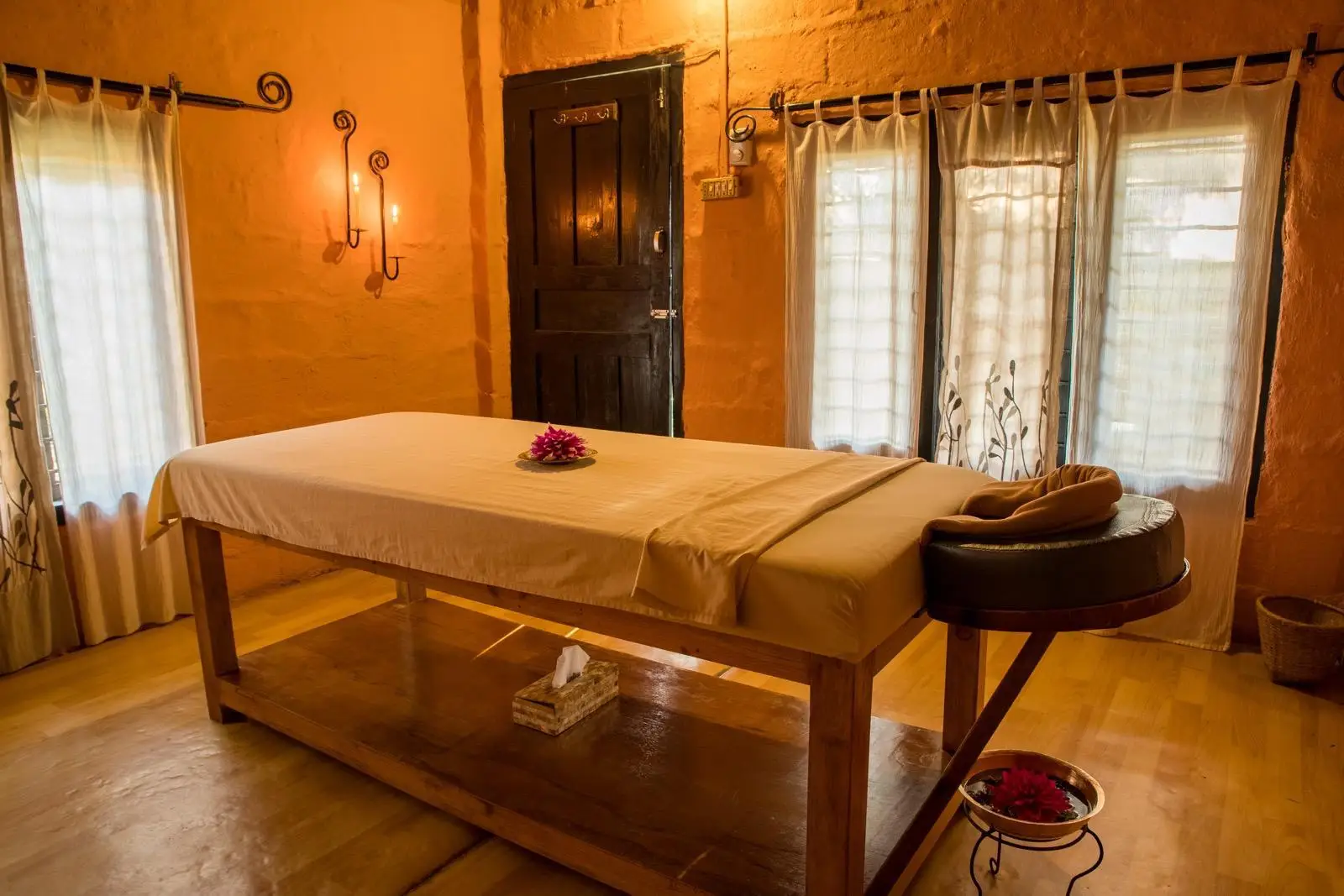 Private treatment room with a single massage bed